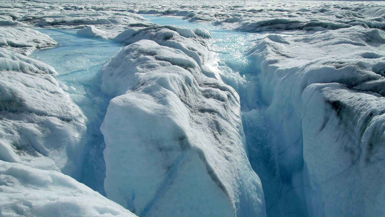 Meltwater from the ice sheet surface is drained through a moulin. The edge zone in the Ilulissat region, West Greenland