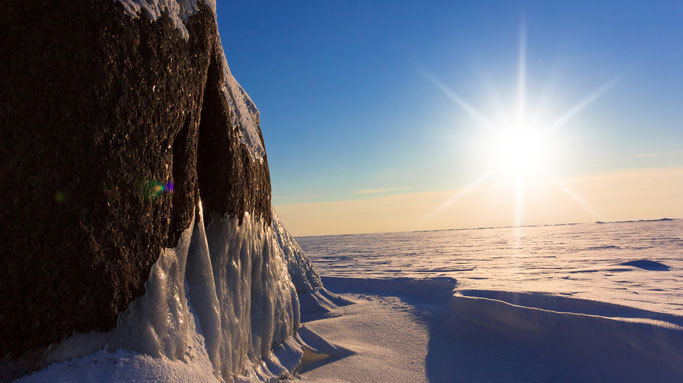 Iced rocks within a snow field.